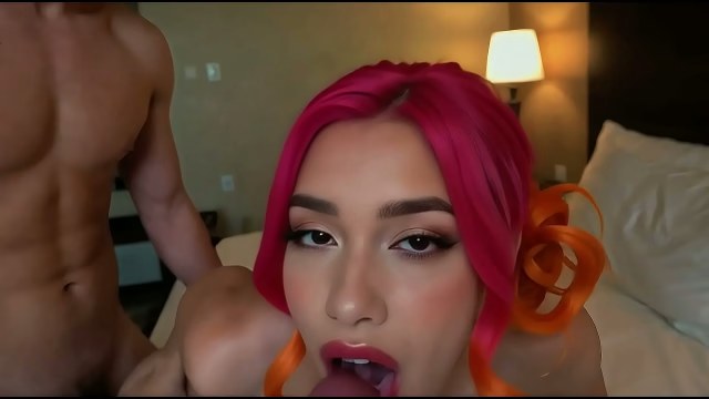 Red-orange-haired nude woman giving a blowjob in a modern bedroom